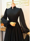 Adorable Black Faux Georgette Floor Length Flared Pleated Designer Gown