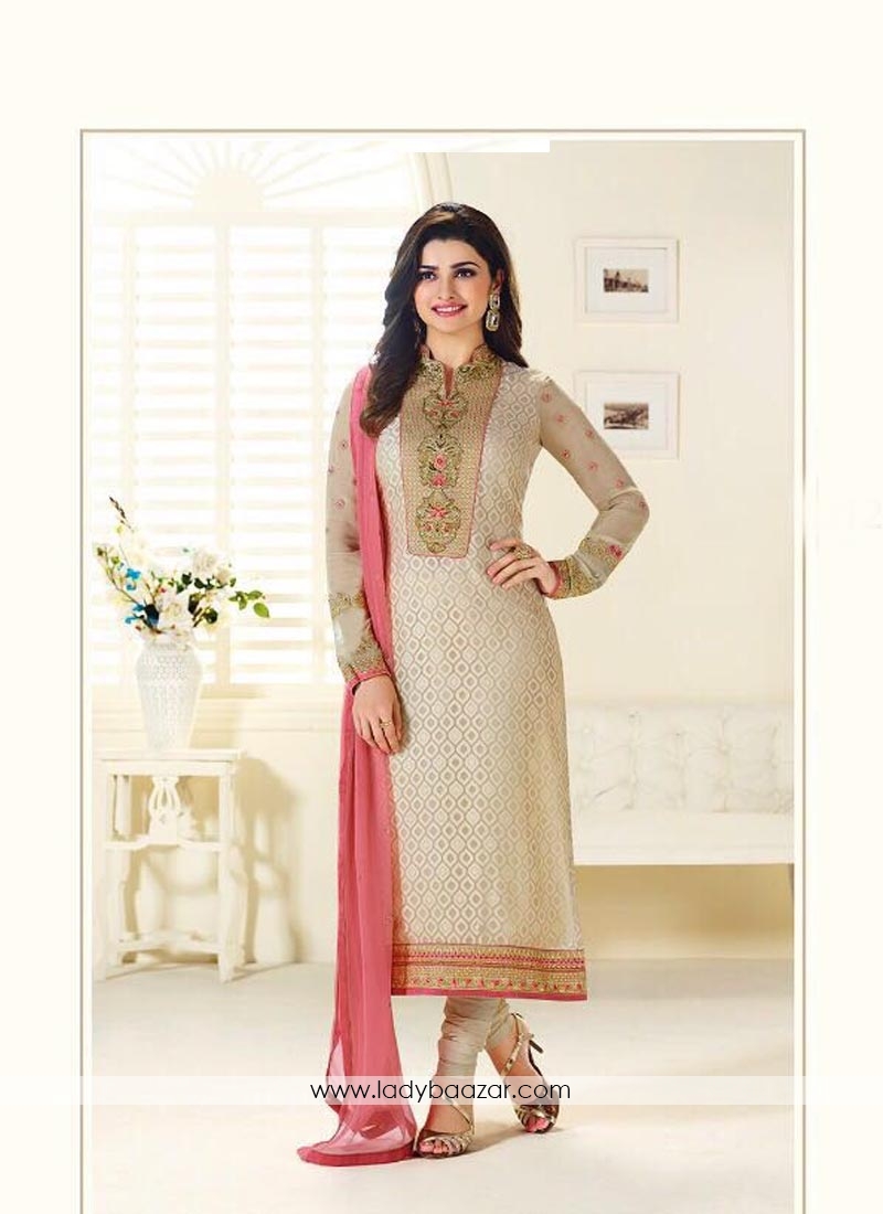 Arresting  Cream Brasso Embroidery Work Salwar Kameez