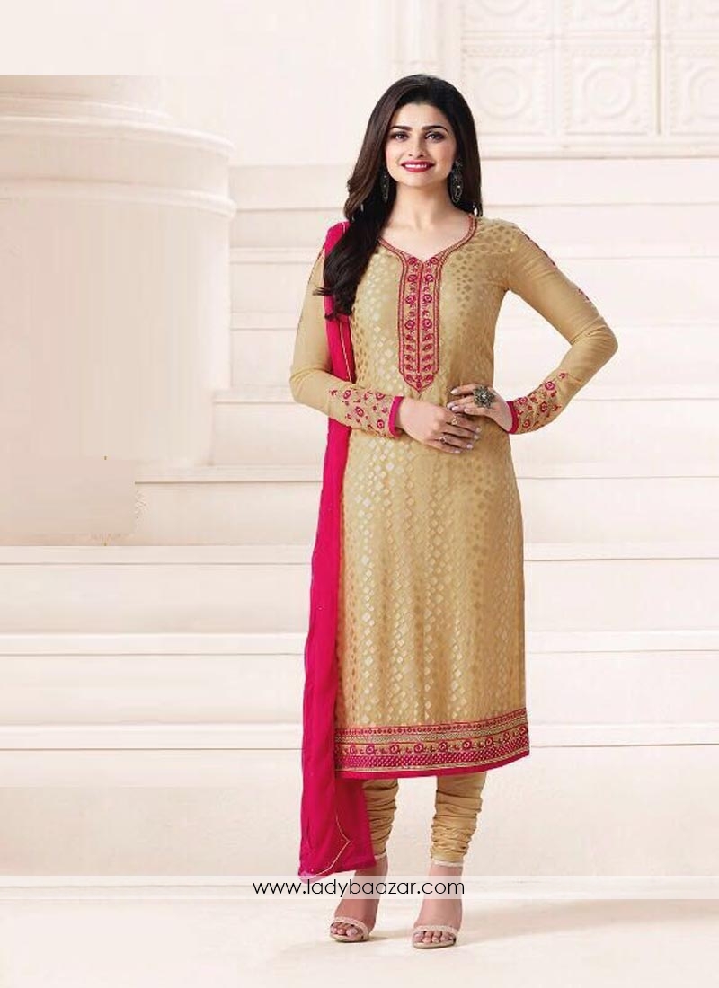 Attractive Embroidery Work Cream Color Churidar Suit