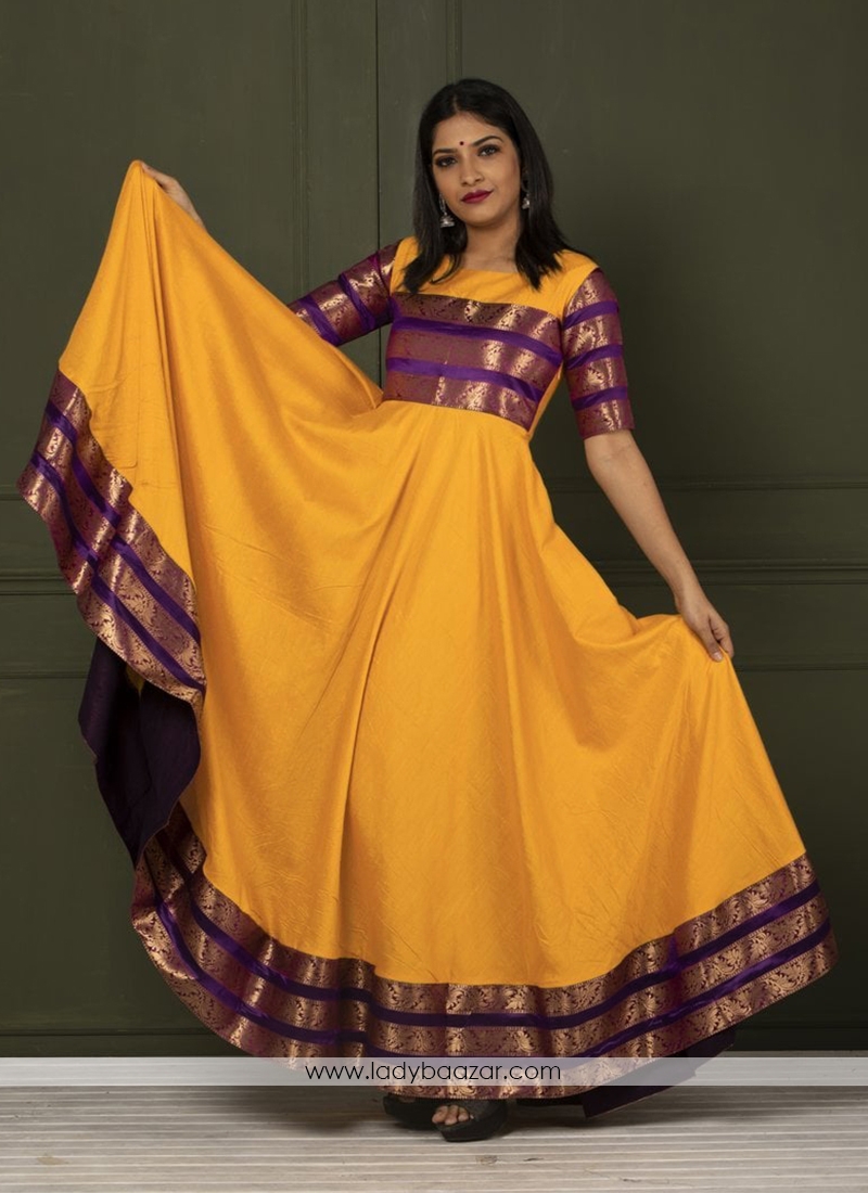 Beautiful Yellow Colored Festive Wear Woven Tapetta Silk Gown