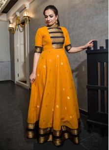 Classy Mustard Colored Party Wear Silk Jacquard Weaving Work Gown