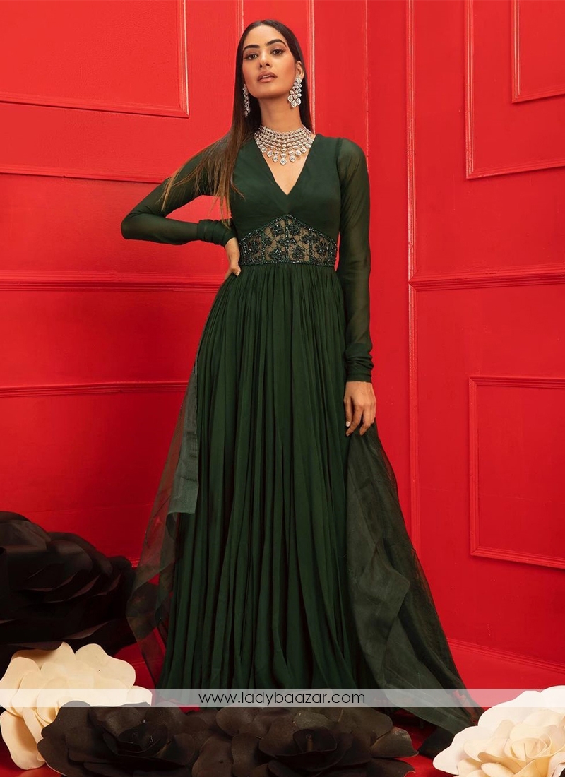 Dark Green Anarkali Gown With V-neckline, Handwork panel at the waist and full sleeves.