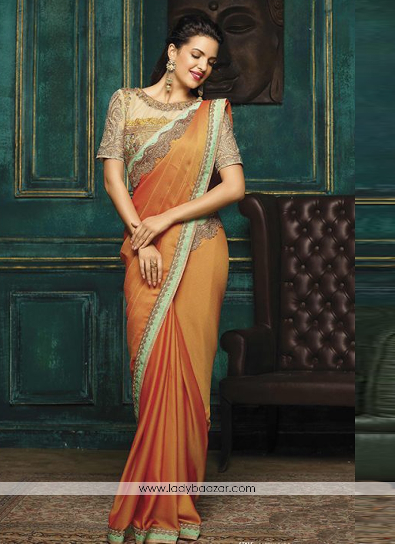 Deserving Embroidery Work Peach Designer Saree