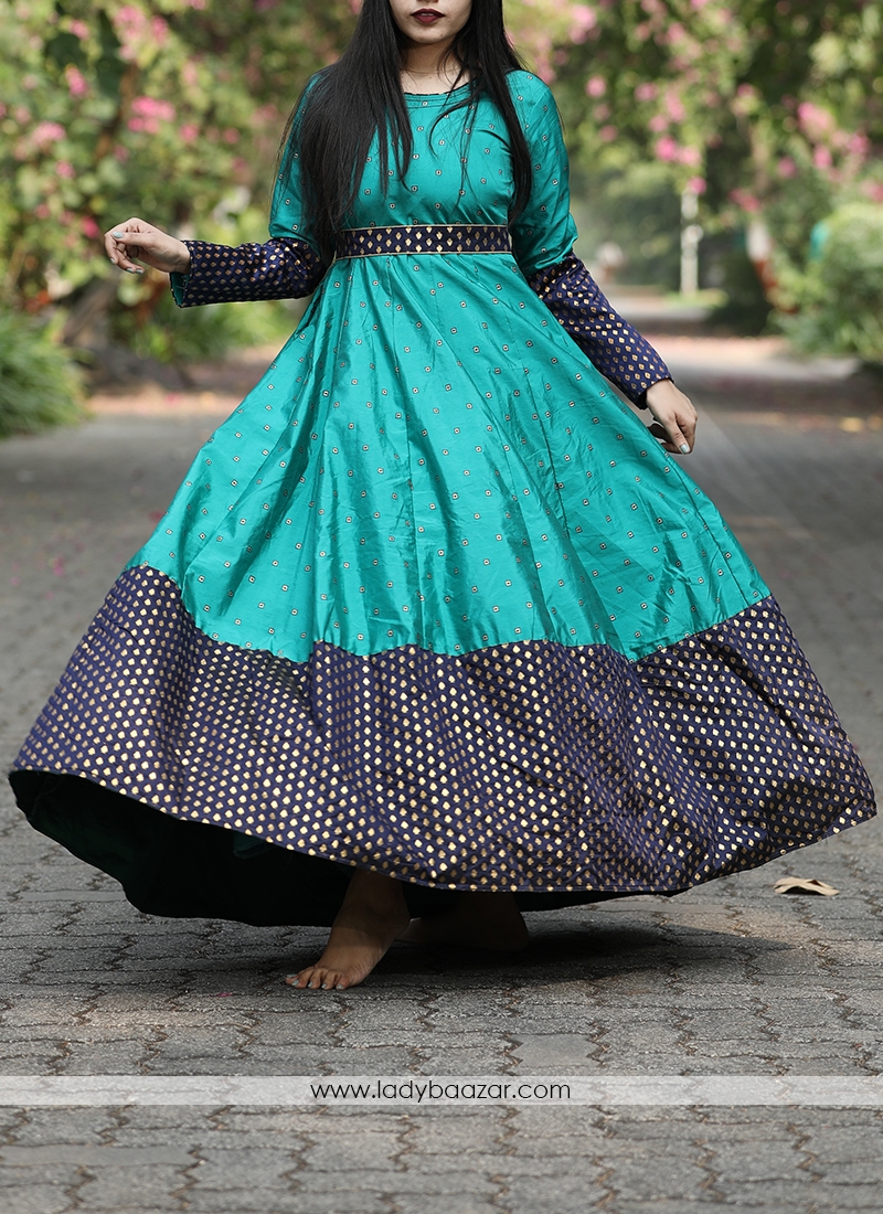 Graceful Rama Green Colored Festive Wear Woven Tapetta Silk Gown