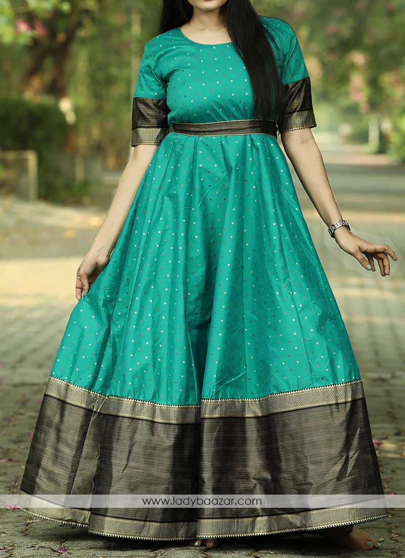 Graceful Rama Green Colored Festive Wear Woven Tapetta Silk Gown