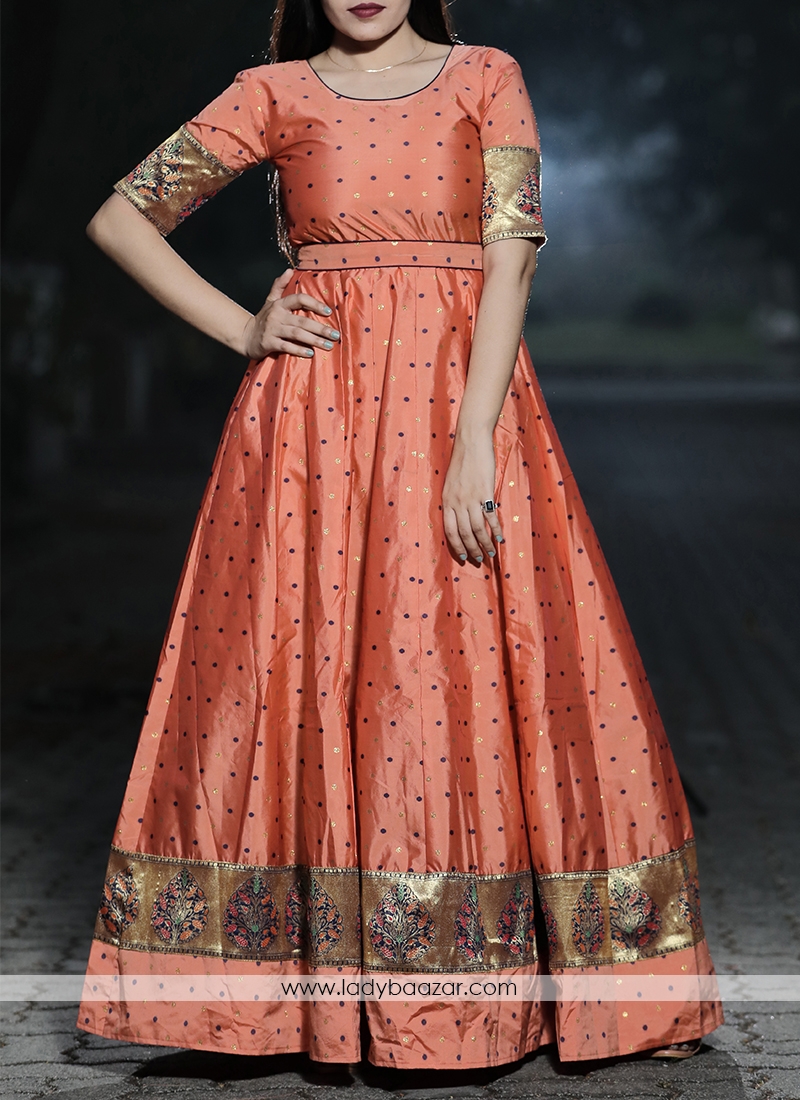 Staring Orange - Peach Colored Festive Wear Woven Tapetta Silk Gown