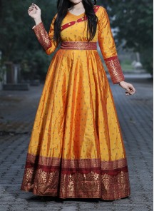 Unique Musturd Yellow Colored Festive Wear Woven Tapetta Silk Gown